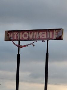 Repaired storm damaged pylon sign. New flex faces, converted to LED, and painted cabinet and poles.